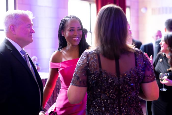 Three people engaged in conversation