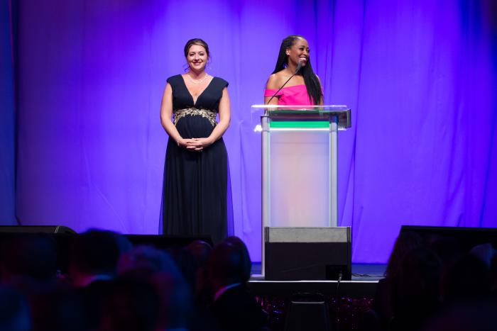 Two women at a podium