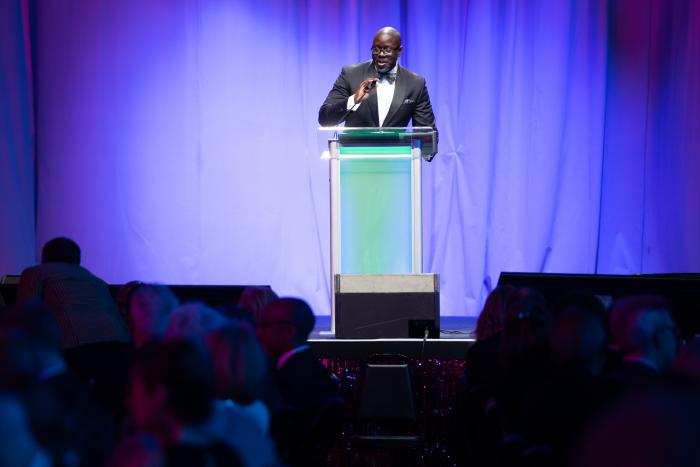 A man stands at a podium