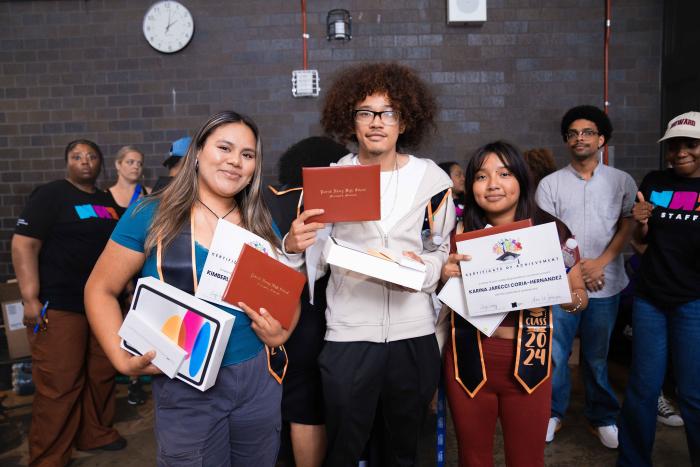 Scholars holding certificates.