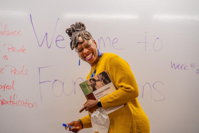 Woman standing in front of a whiteboard