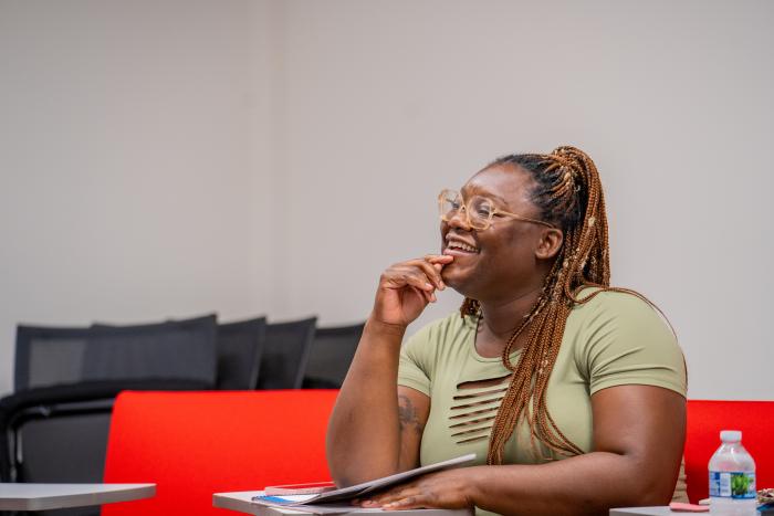 Woman sitting in a classroom setting